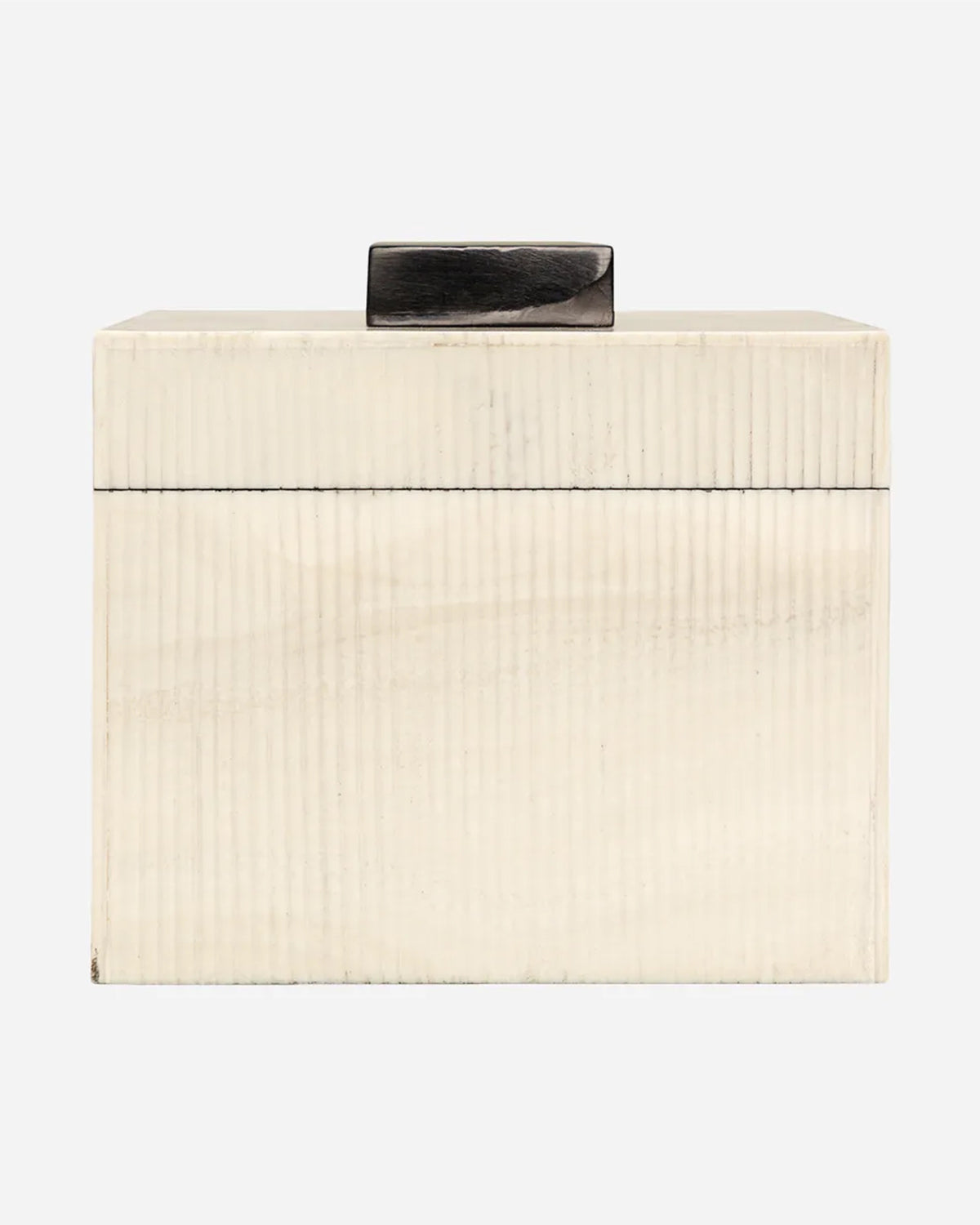 The Import Collection's 46-056 Foley Box is a rectangular cream-colored storage box with subtle vertical ridges and a dark handle, ideal for modern home decor. Shown against a plain white background.