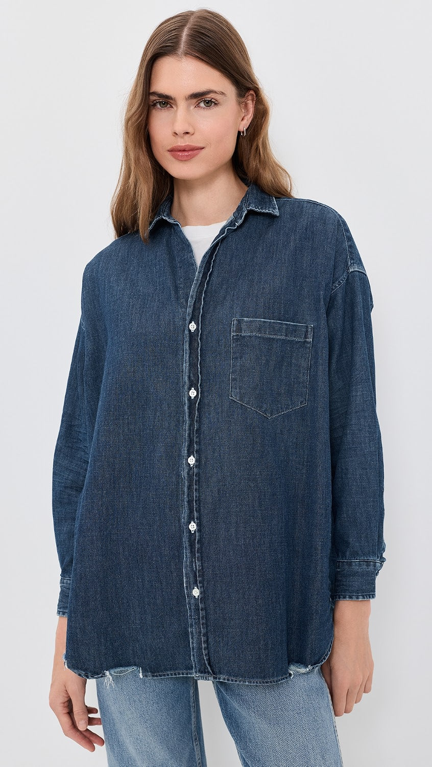Frank &amp; Eileen Shirley oversized dark indigo distressed denim button-down shirt worn by a woman.