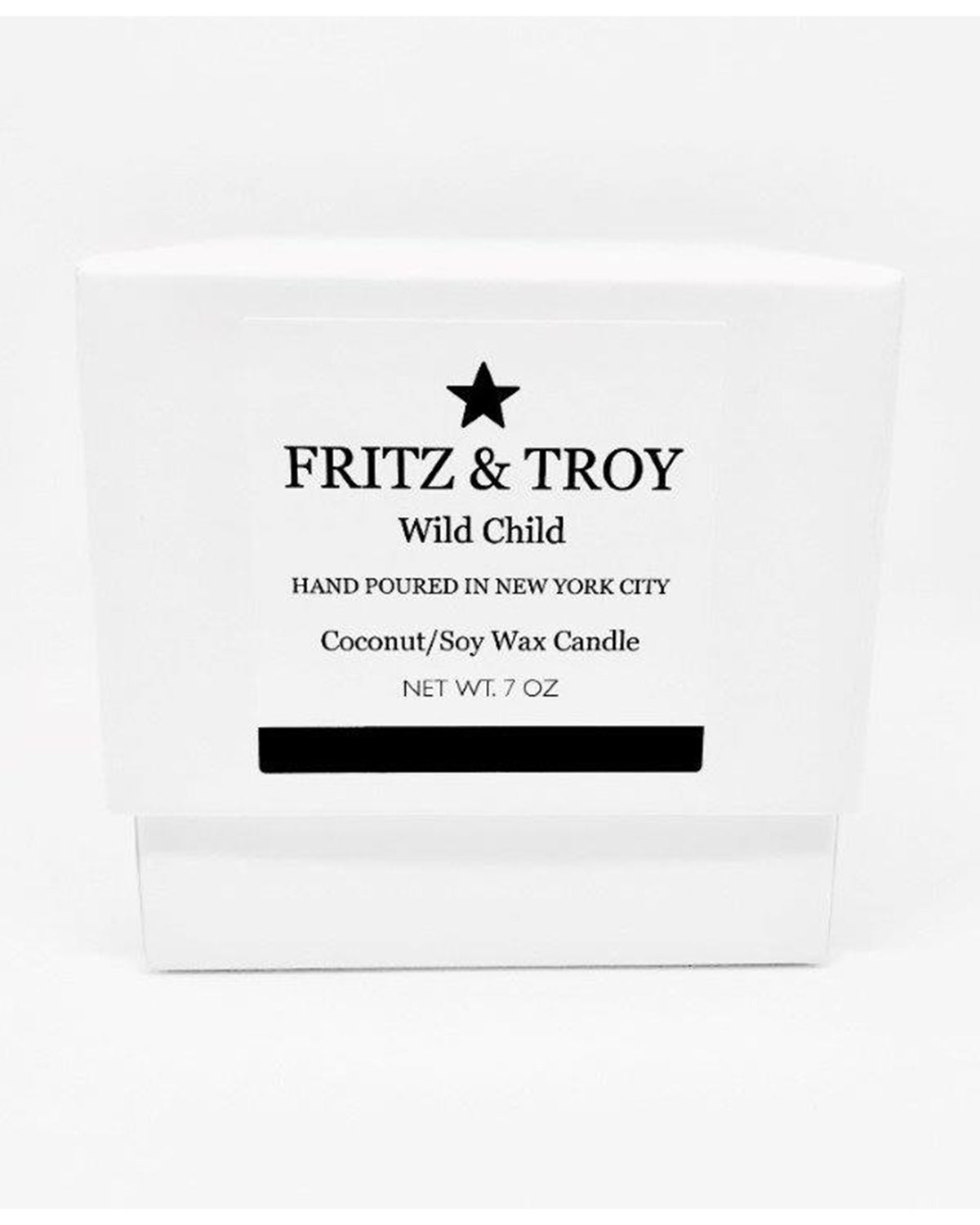 A white candle box labeled "Fritz & Troy Wild Child" holds a hand-poured coconut/soy wax candle made in NYC, with mandarin, jasmine, and amber notes. "NET WT. 7 OZ" is printed boldly on the front.