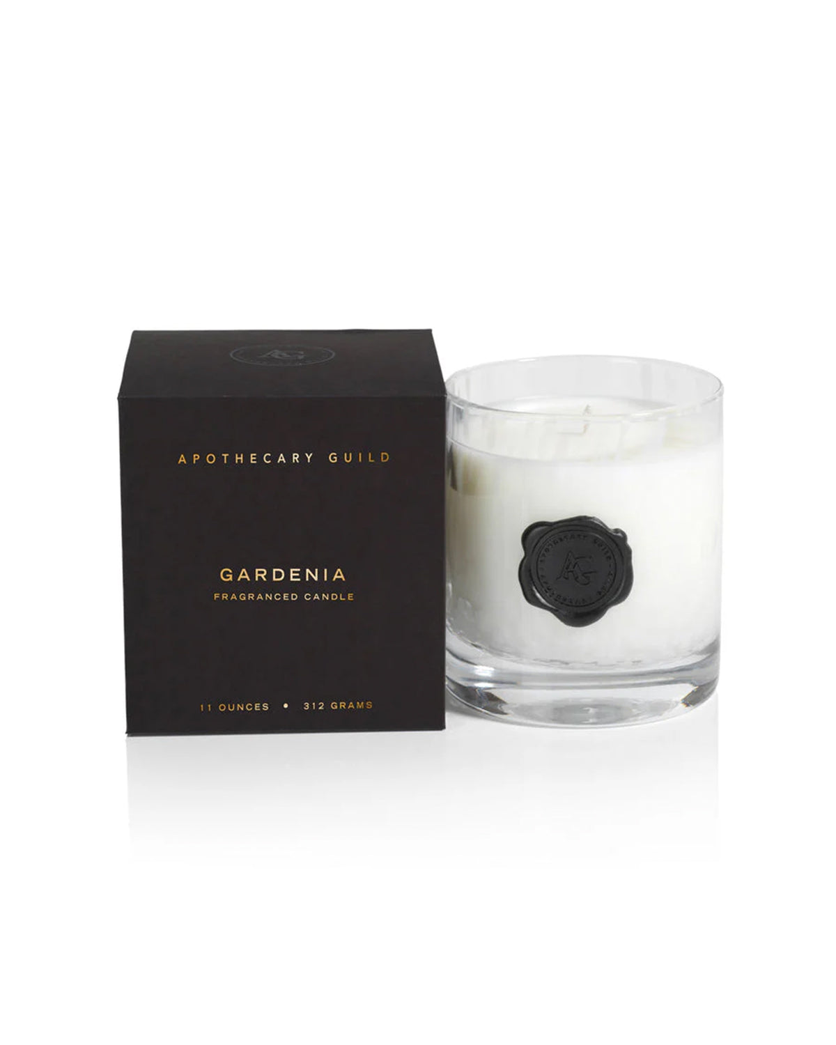The Zodax IG-2647 Opal Candle, Gardenia scent (11oz), comes in a white jar beside its stylish black box, ideal for those who value elegant, fragrant luxury candles.