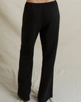 Black Georgia Crepe Pant with wide-leg, high-waisted fit and elastic waistband, back view.