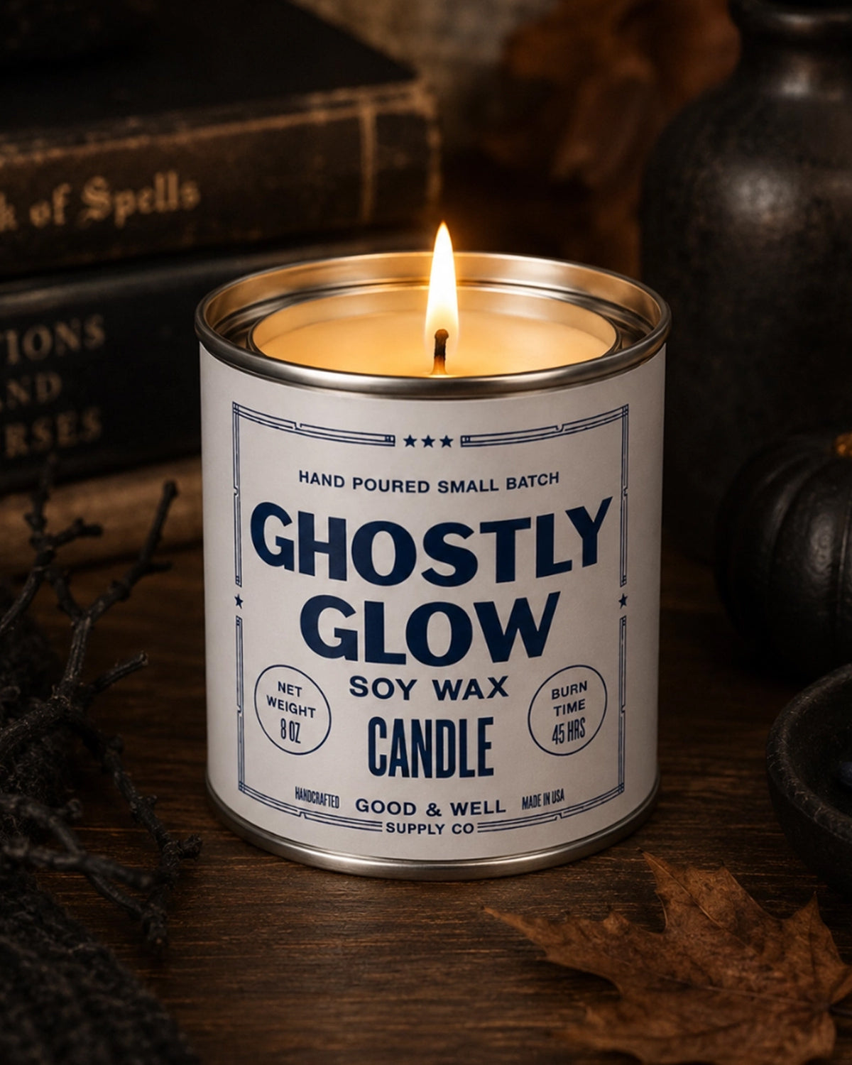 Ghostly Glow soy candle by Bungalow Furniture, glowing warmly among vintage books and autumn decor for a Halloween vibe.