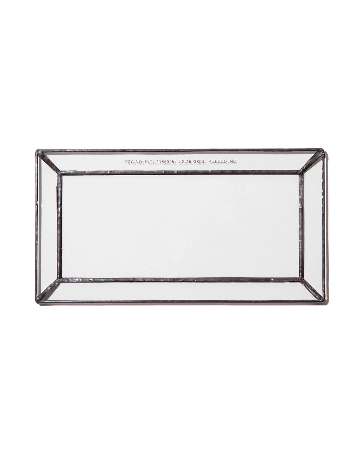 The Faire Glass Valet Tray features a rectangular beveled glass design with a raised edge and silver metal frame, shown from above on a white background.