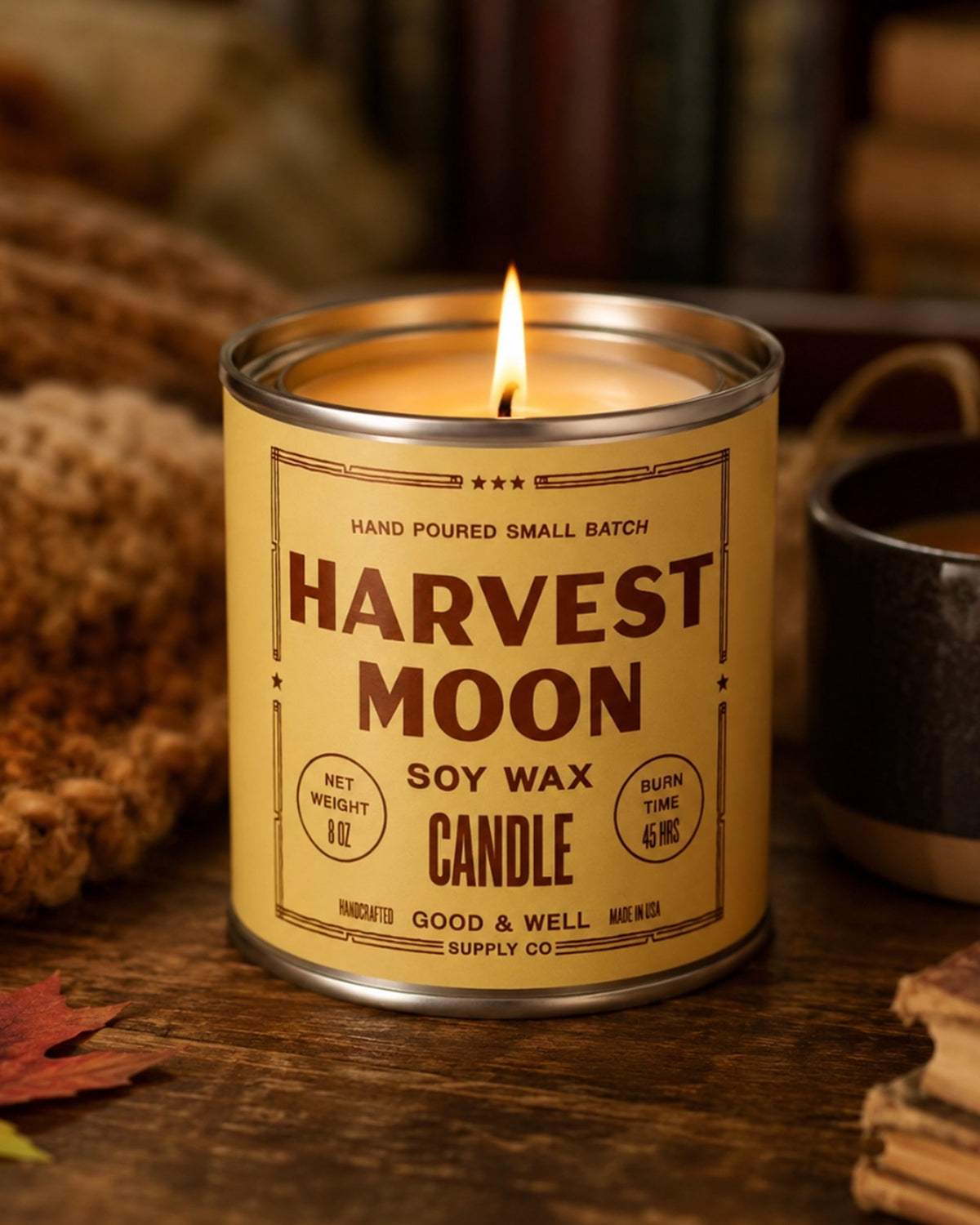 Harvest Moon Soy Candle by Faire in a glass jar, soy wax with autumn scents on a wood table.