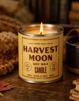 Harvest Moon Soy Candle by Faire in a glass jar, soy wax with autumn scents on a wood table.