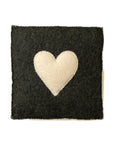 The Indaba Cream Heart Wall Plaque showcases a delicately stitched cream heart on a black felt square, captured against a plain white background.