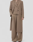 CLOSED wide-leg suit and blazer in neutral tone, minimal style against plain backdrop.