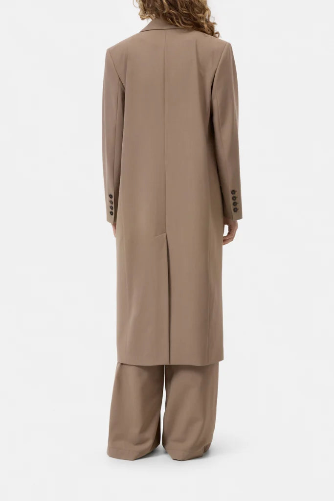 Blazer coat and wide-leg pants by CLOSED, back view against a plain background, modern tailored style.