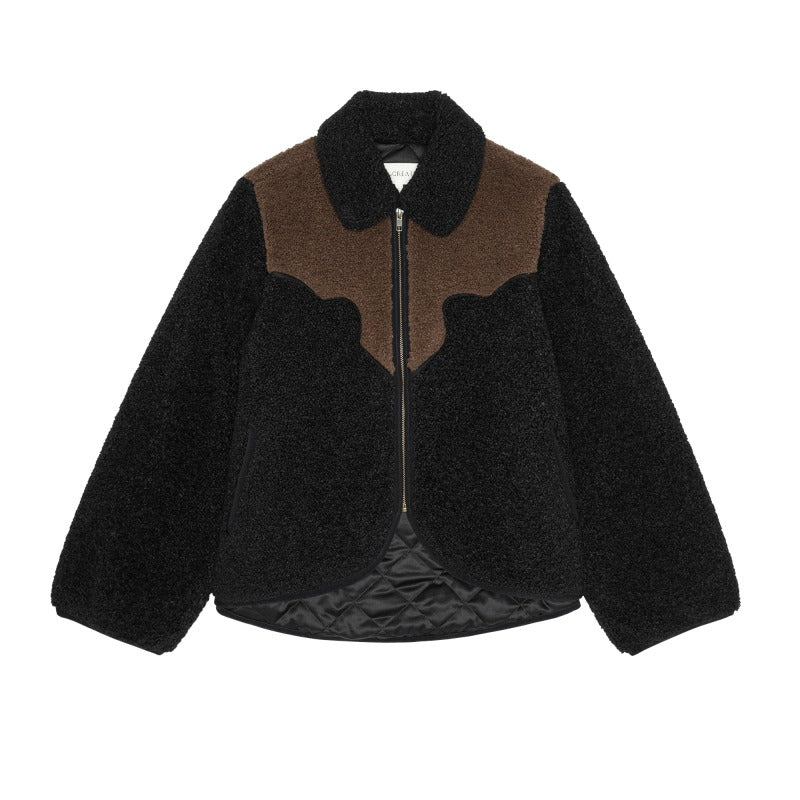 Black and brown reversible jacket with curved color-block chest and quilted lining by The Great Inc.