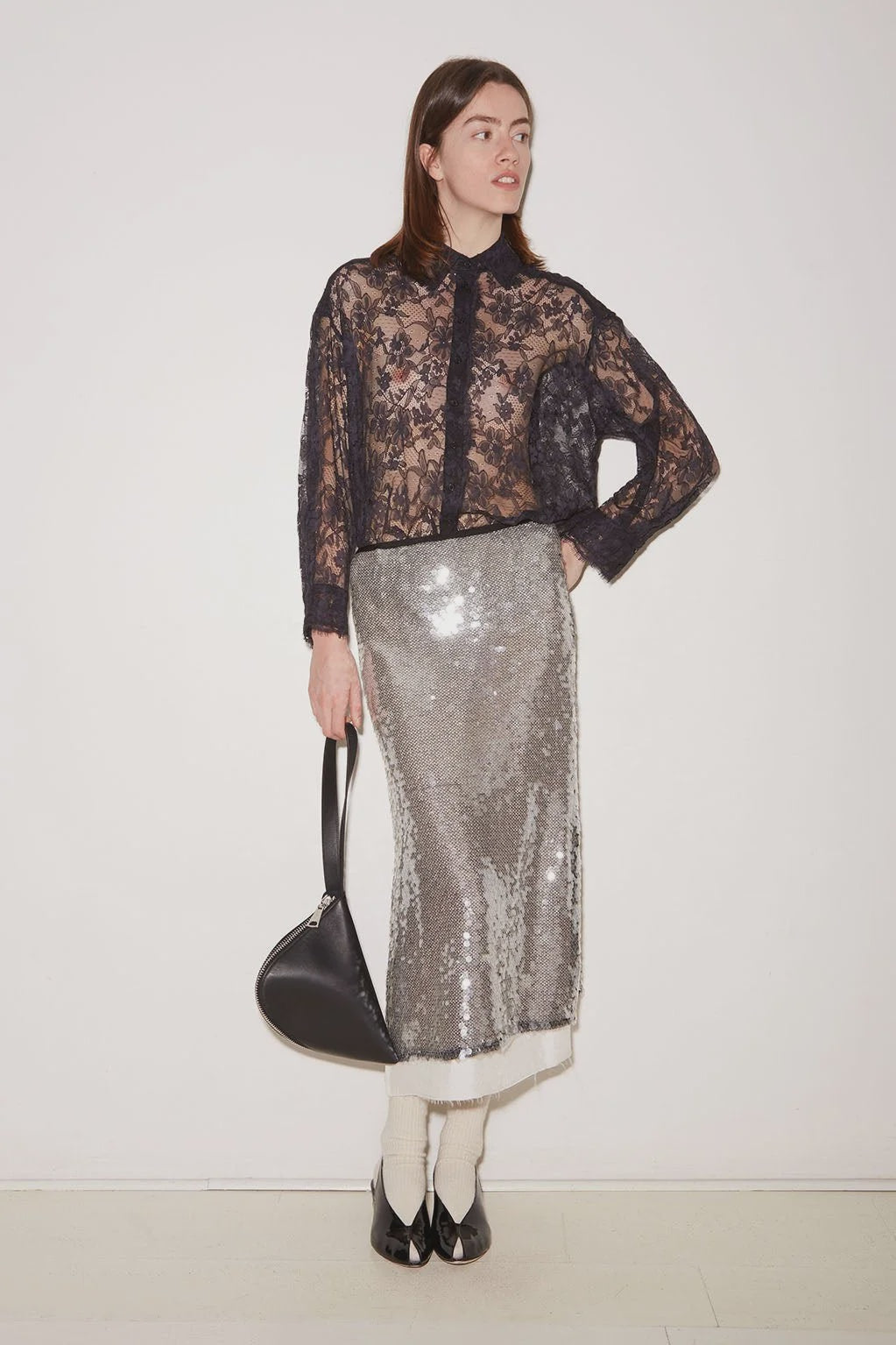 Metallic silver sequin Jupe Skirt by Roseanna worn with a black lace button-up shirt.