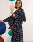 Dorrington Jacket by Hunter Bell NYC in playful setting with oversized colorful paper spheres indoors.
