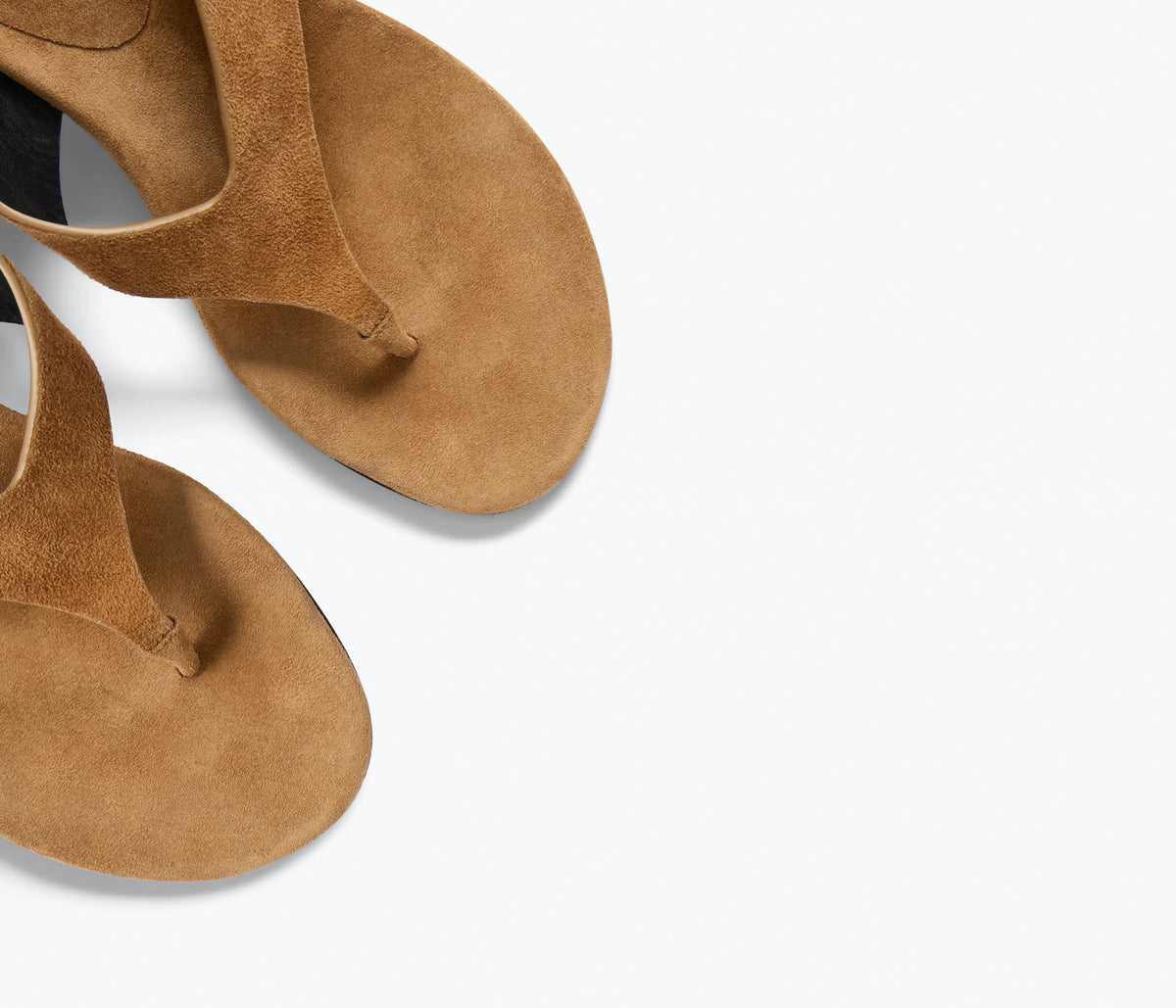 Close-up of the Freda Salvador KAT tan suede heeled thong sandals with a minimalist design, photographed from above on a plain white background.