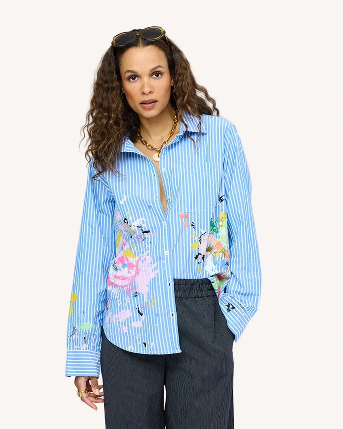 Blue striped Kerri Rosenthal Mia Happimess shirt styled with gray pants and gold necklace, casual modern look.