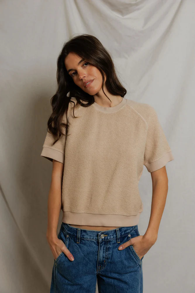 Beige Perfectwhitetee Kennedy SS Crew Sweatshirt styled with blue jeans, casual look against fabric backdrop.