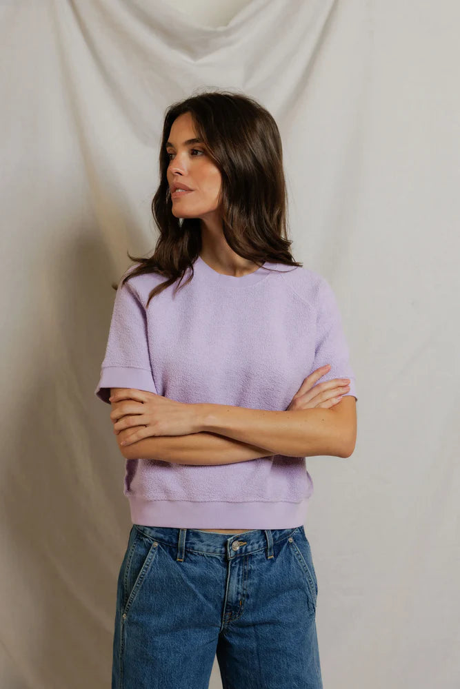 Perfectwhitetee Kennedy SS Crew Sweatshirt in soft cotton, paired with blue jeans, relaxed look against neutral backdrop.