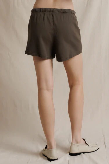 Brown Perfectwhitetee Layla Terry Shorts with elastic waist, styled with cream loafers against a simple backdrop.