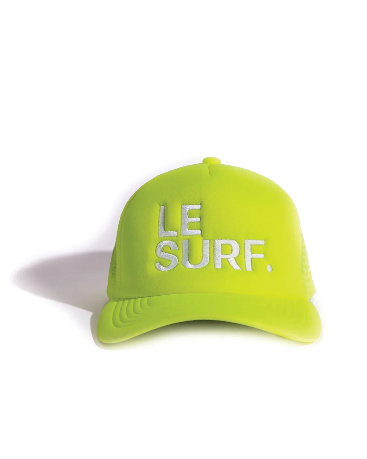 The Le Surf Hat by Ping Pong Surf Club is a neon yellow-green mesh trucker cap with "LE SURF." embroidered in white on the front, shown against a white background.