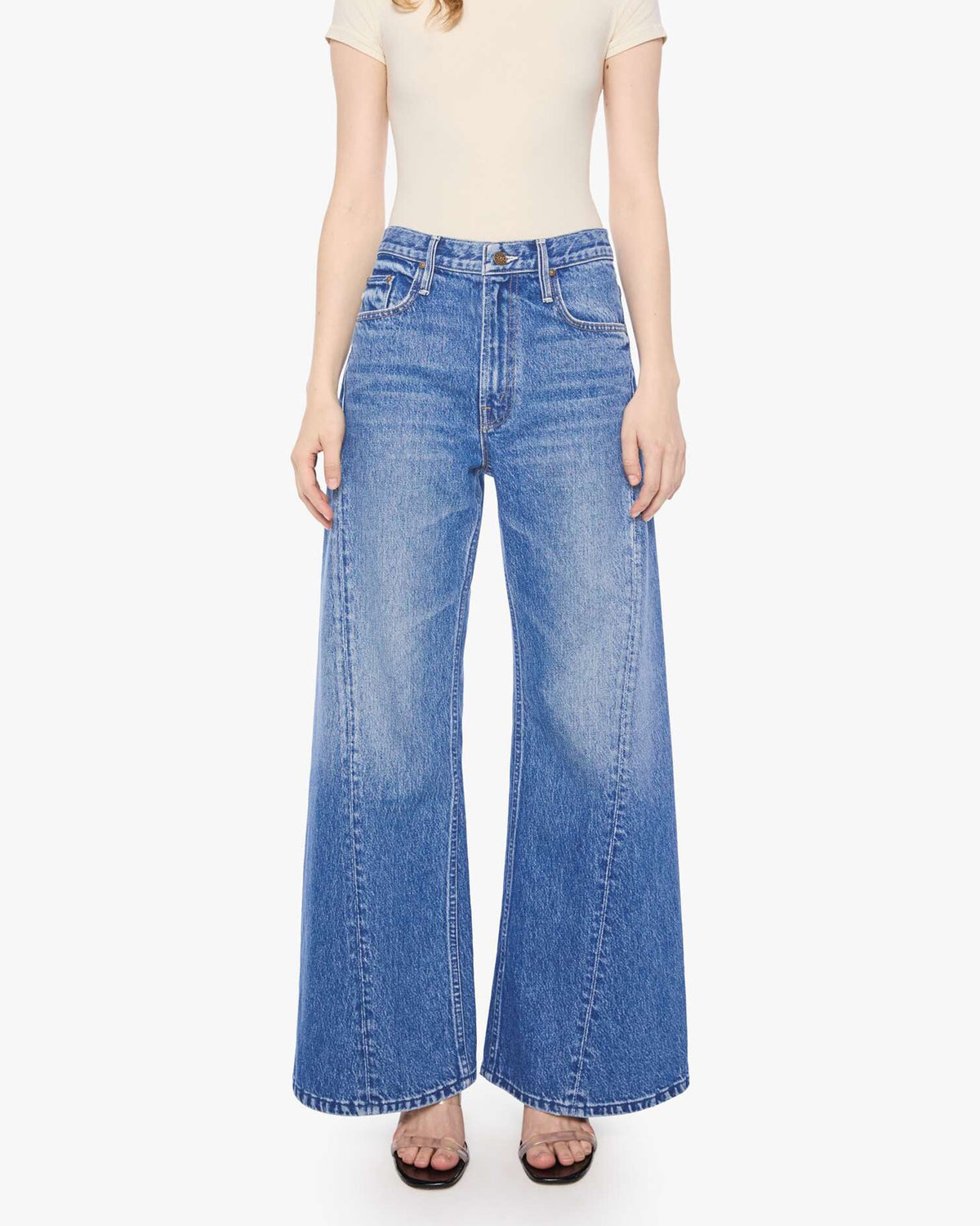 Mother’s Lil Lemon Twist Skimp jeans in light wash, slim fit, modeled against a plain white background.