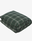 Green plaid duvet cover by Libeco Home, neatly folded on a white background.