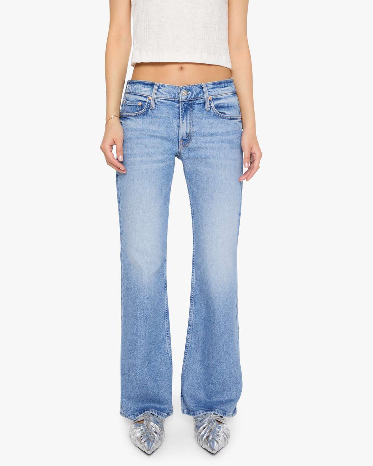 Mother Lil Jinx Sneak petite bootcut jeans in light wash blue, paired with a white tank and metallic pointed-toe flats.