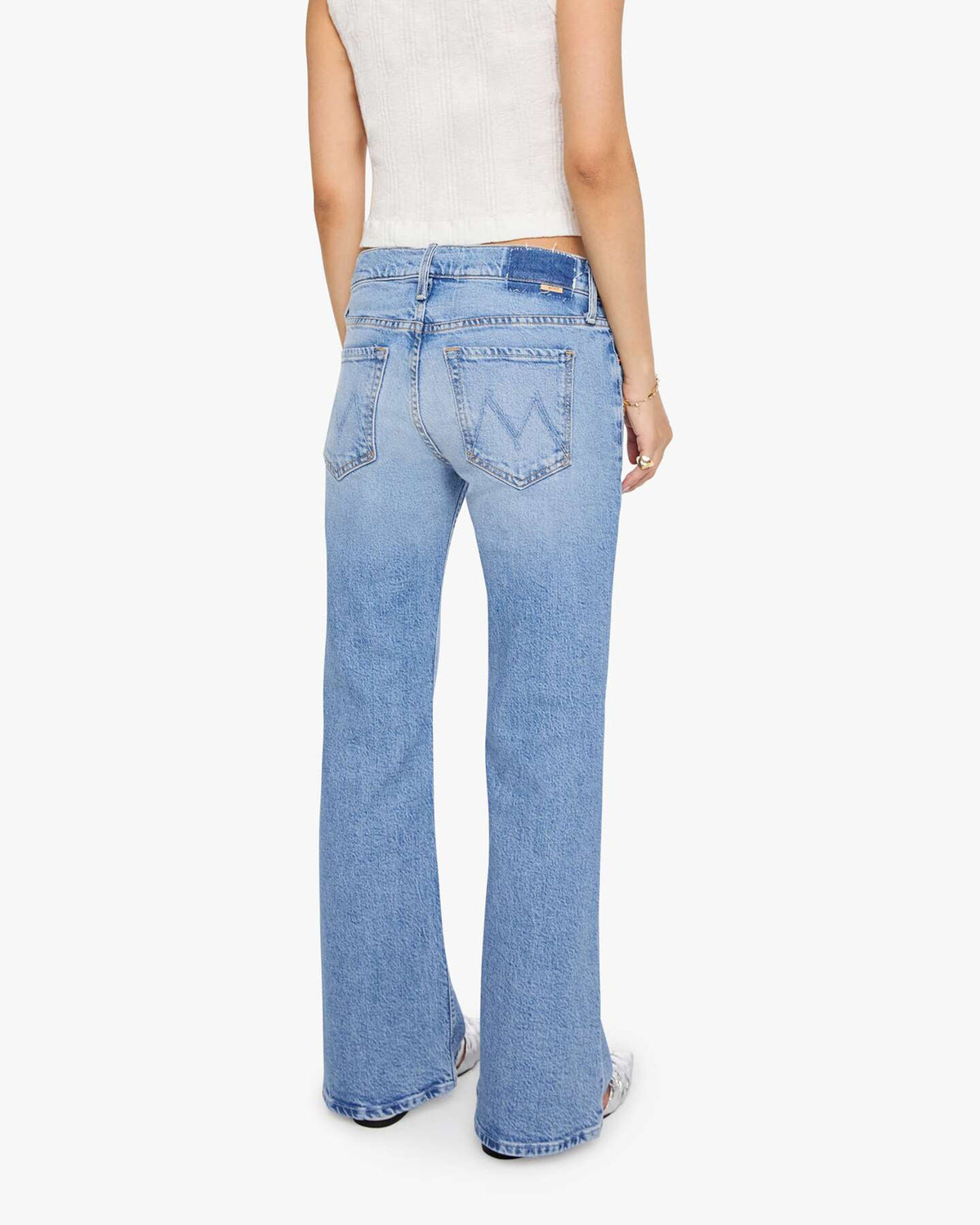 Light-wash blue petite bootcut jeans by Mother, Lil Jinx Sneak style, featuring a straight-leg fit and leather patch.