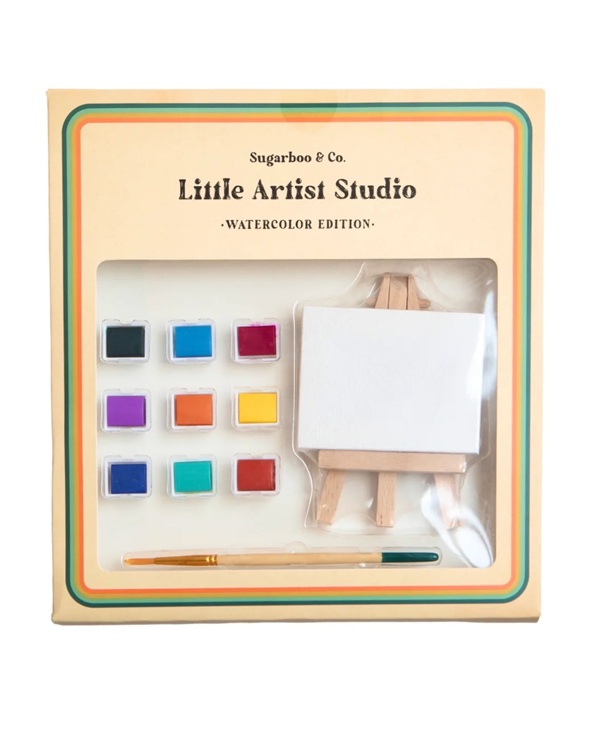 Sugarboo Designs’ Little Artist Studio set features eight washable paints, a mini canvas with wooden easel, and a paintbrush in cream-colored packaging with colorful borders for a playful, creative vibe.