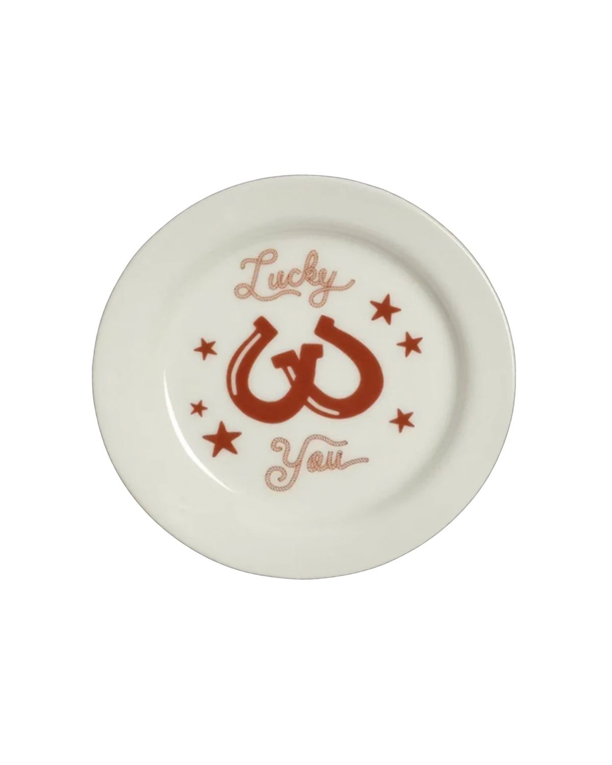 Round white plate with red horseshoes and stars, Lucky You script at center, by Fishs Eddy for Bungalow Furniture.