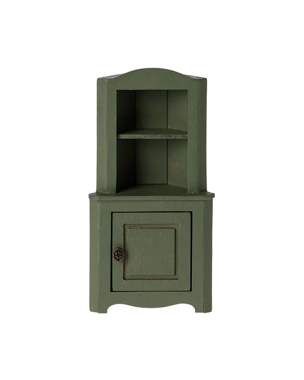 The Maileg Corner Cabinet by Maileg is a compact green wooden unit with an upper shelf and a closed door below, providing space-saving storage. It is shown against a plain white background.