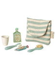 Striped pouch with cup, toothbrush, toothpaste, and shampoo from Maileg Toothbrush Set, ideal for kids’ bathroom accessories.
