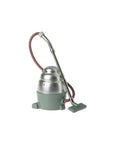 Metal Maileg Vacuum Cleaner with green base and red hose on white background, by Bungalow Furniture & Accessories.