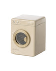 The Maileg Washing Machine by Maileg is a small, beige, rectangular toy with a gold-rimmed round door and top buttons—an adorable addition for imaginative laundry adventures with your mouse family. Photographed on a white background.