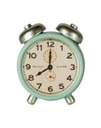 Maileg mint green alarm clock with metal bells set to 7:00, styled in Mouse Hole Farmhouse decor.