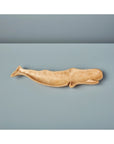 Kiln Mango Wood Whale Dish by Be Home on a smooth light blue surface with matching background.