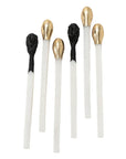 Six Matchstick Sculptures with white stems and metallic gold or textured black tips by Bungalow Furniture & Accessories.