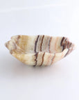 Amber mix onyx bowl with wavy edge, beige, brown, and cream stripes by Faire Bowl, perfect for modern decor.
