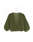 Hand-knitted olive green Maiami Mohair Bomber Cardi with voluminous sleeves on a hanger.
