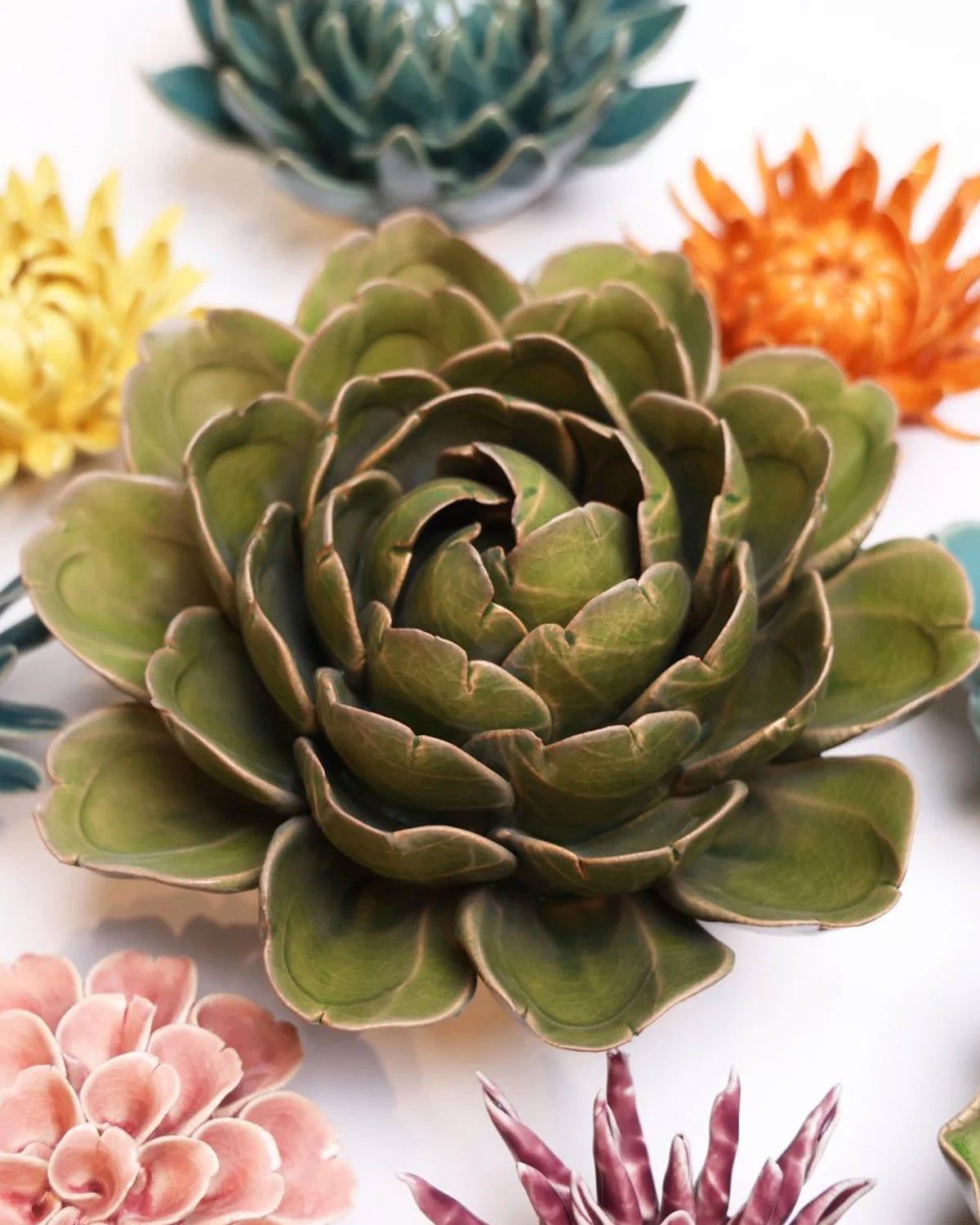 Moss Green Botanicals ceramic flower with layered petals in a rosette shape by Bungalow Furniture &amp; Accessories.
