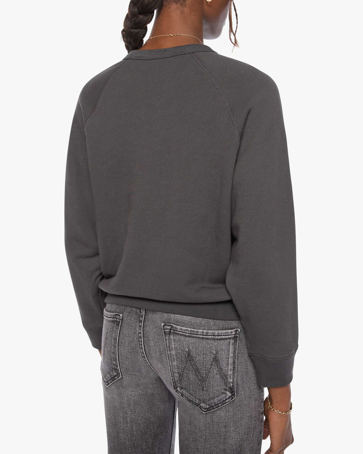 Back view of The Concert shrunken raglan sweatshirt and faded black Mother jeans in black on white background.