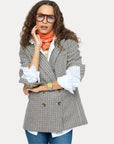 Kerri Rosenthal Mr. Frenchie Blazer styled with white shirt, orange scarf, and blue jeans; casual chic look.