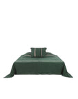 Dark green Belgian linen coverlet with light stripes by Libeco Home, minimalist bedding for bedroom decor.