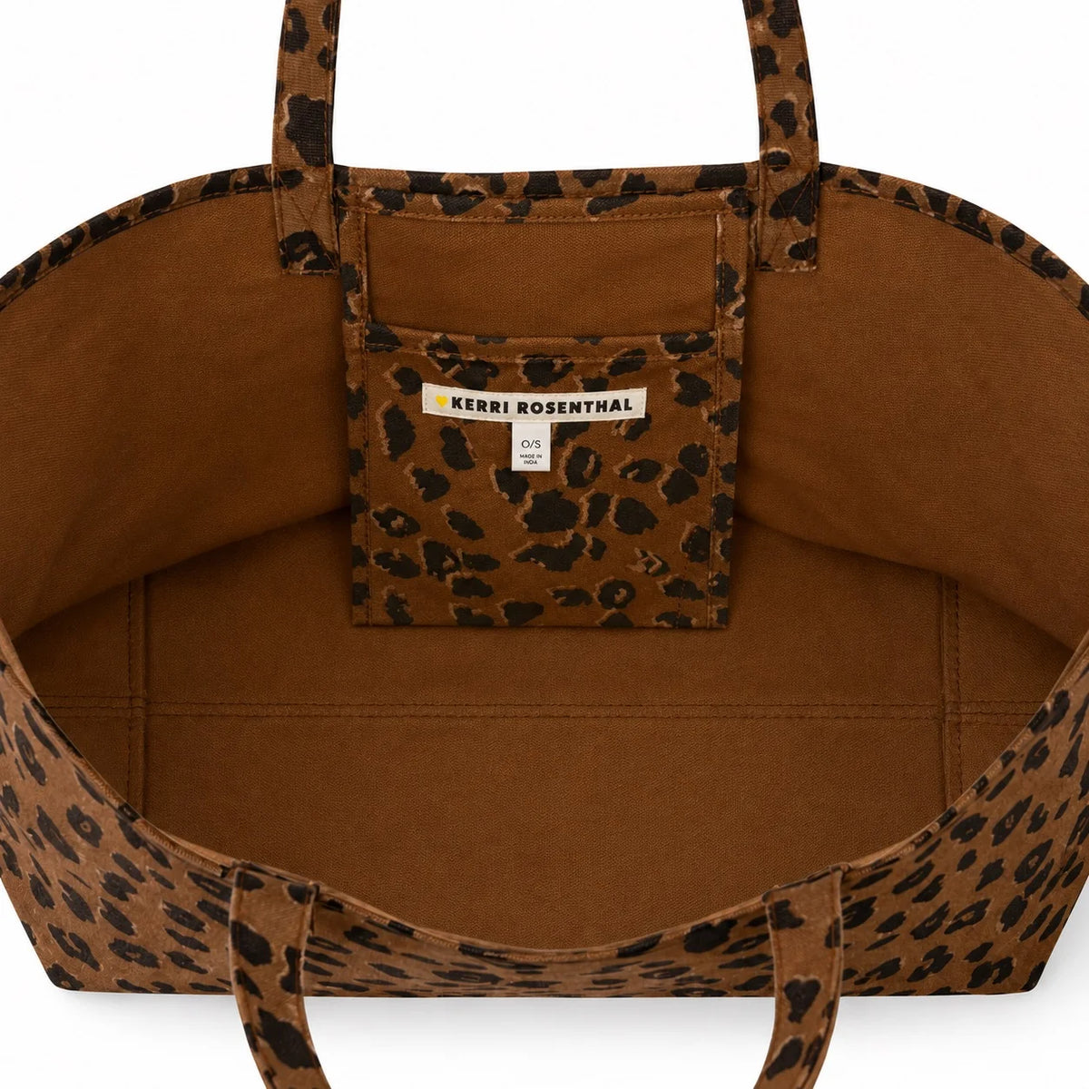 Brown cheetah print canvas tote with inner pocket, Kerri Rosenthal label above pocket, Bungalow Furniture & Accessories.