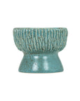 The Norlin Bowl by The Import Collection features a blue ceramic design with a ribbed upper half, smooth flared base, and speckled finish—perfect as a decorative accent or for stylish tabletop displays.