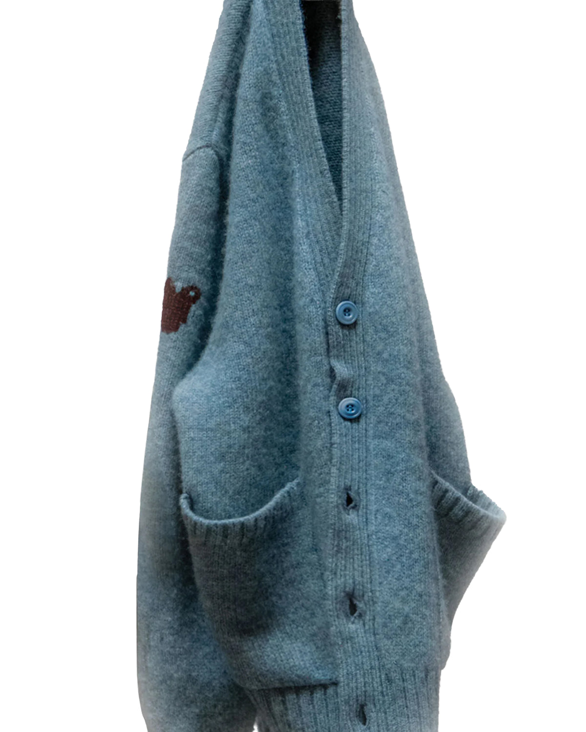 Norwegian Blue SuperYumm wool pocket cardigan with two pockets and a dark upper sleeve graphic.