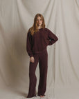 Perfectwhitetee Marley fleece pants in white, shown barefoot and front-facing on a plain backdrop.