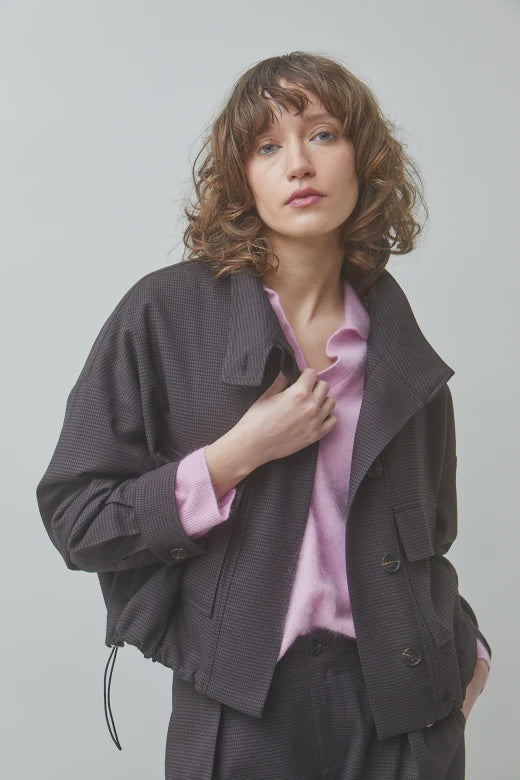 SUNCOO Dollar oversized jacket in light purple styled on a model with wavy brown hair, casual modern look.