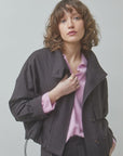 SUNCOO Dollar oversized jacket in light purple styled on a model with wavy brown hair, casual modern look.