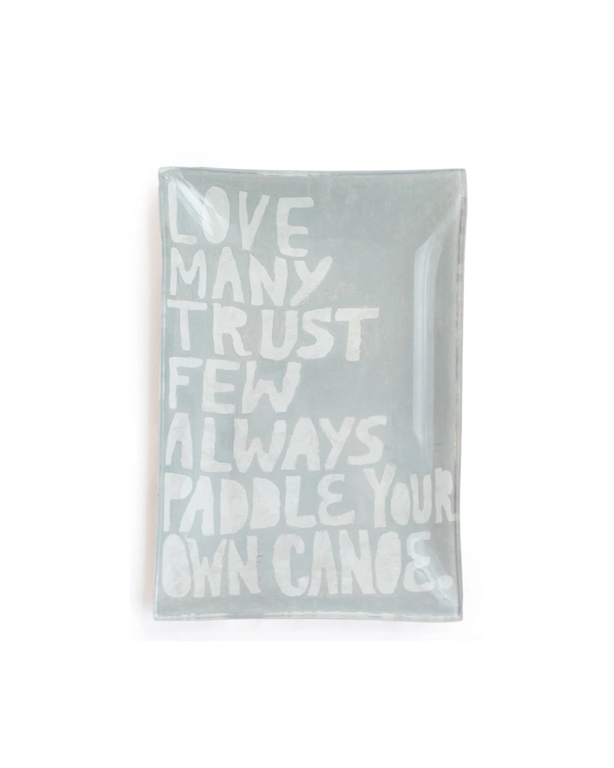 The Sugarboo Designs Paddle Your Own Canoe Rec Plate is a rectangular glass tray with "LOVE MANY TRUST FEW ALWAYS PADDLE YOUR OWN CANOE" in bold white on pale gray, ideal as a jewelry holder or display piece alongside art prints.