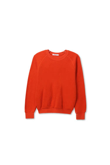 The Perfectwhitetee Ziggy Reverse LS Sweatshirt features a vibrant orange, long-sleeve crew neck design made from soft cotton fleece, shown flat on a white background.