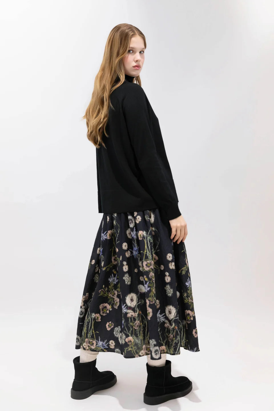 Psophia 2894 black skirt styled with matching top and boots, Bungalow Furniture & Accessories, minimal backdrop.