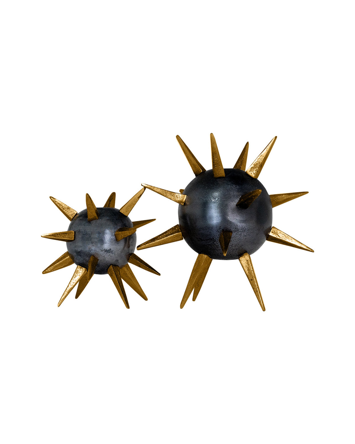 The Import Collection Punk Candleholder set features two metallic spheres with bold gold spikes—one large, one small—offering striking industrial decor for your space. Displayed against a white background, these unique pieces make a standout accent.